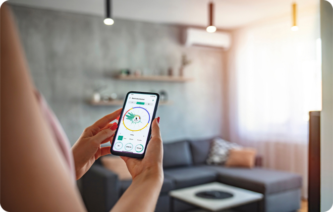 Emerald Electricity Advisor Emerald App in hand woman living room