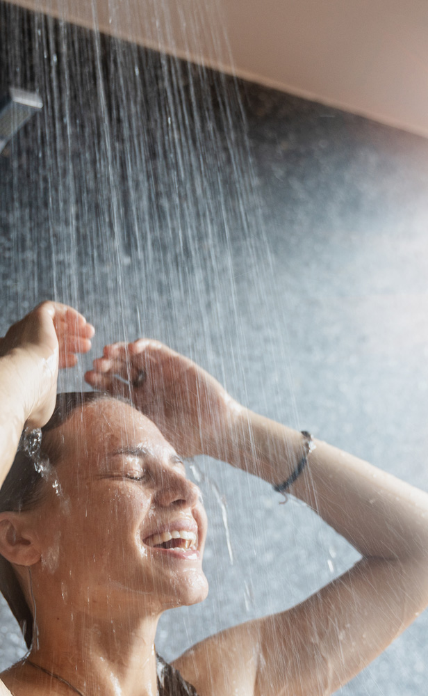 Emerald heat pump woman singing in shower