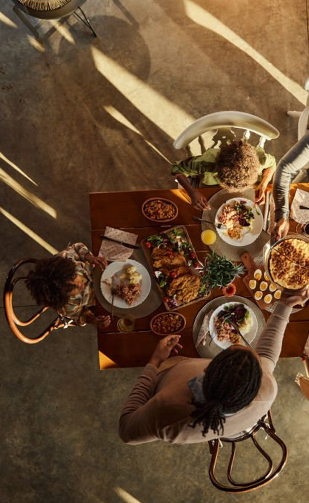 Above view of black extended family having lunch at dining table