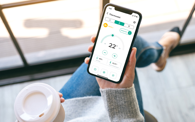 Emerald AC Link Emerald App in hand woman with coffee