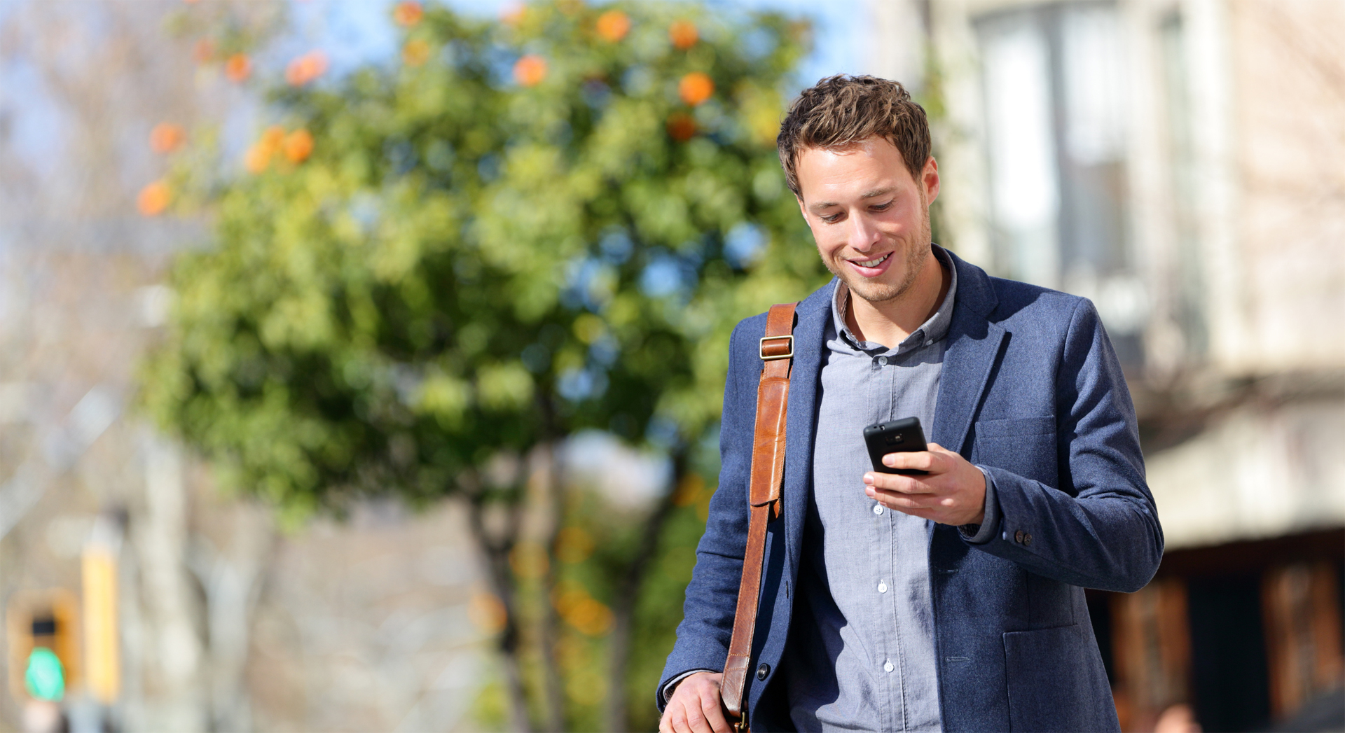 Emerald app - man using phone outside