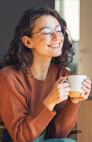 Emerald ducted air conditioning - cold morning lady drinking tea