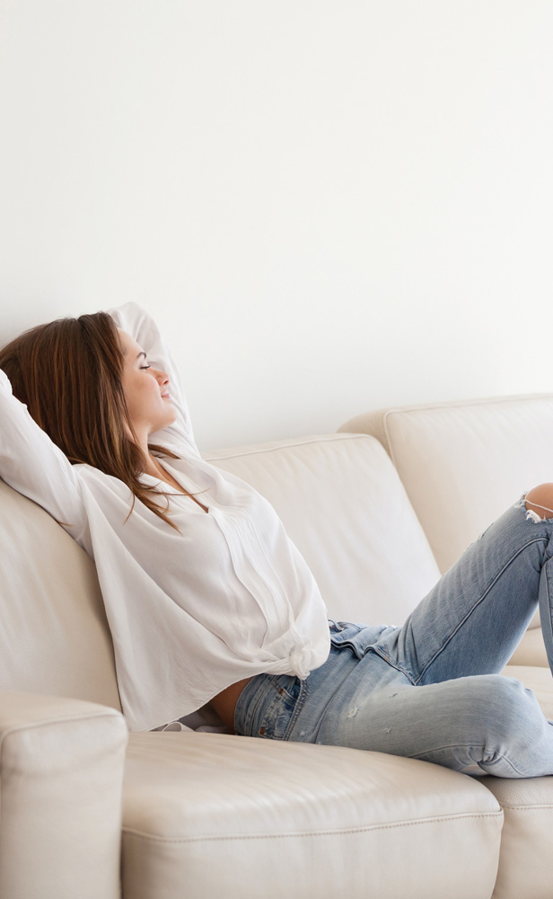 Emerald Air Con Split System indoor unit lifestyle woman on lounge