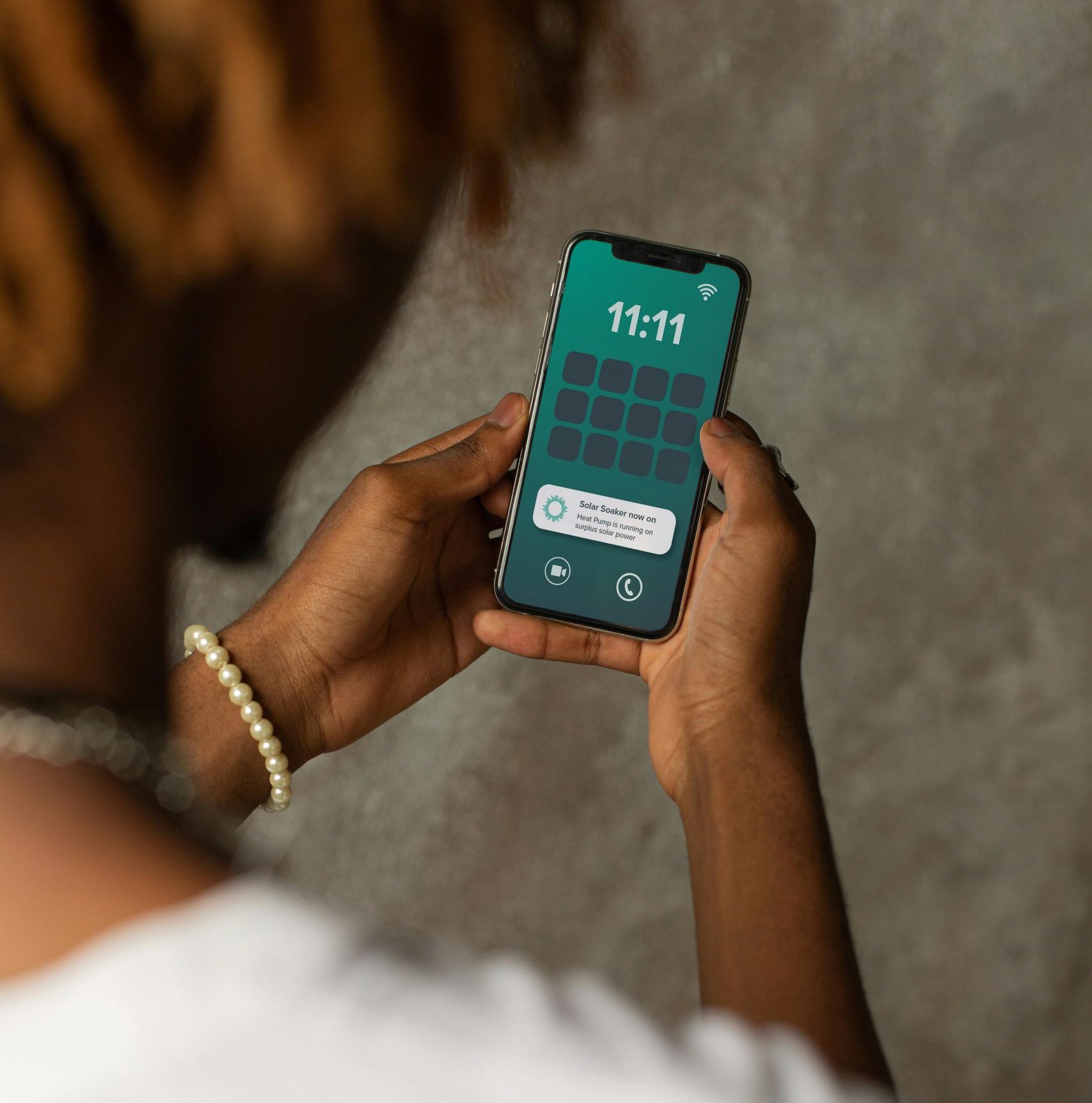 Emerald Electricity Advisor Emerald App in hand