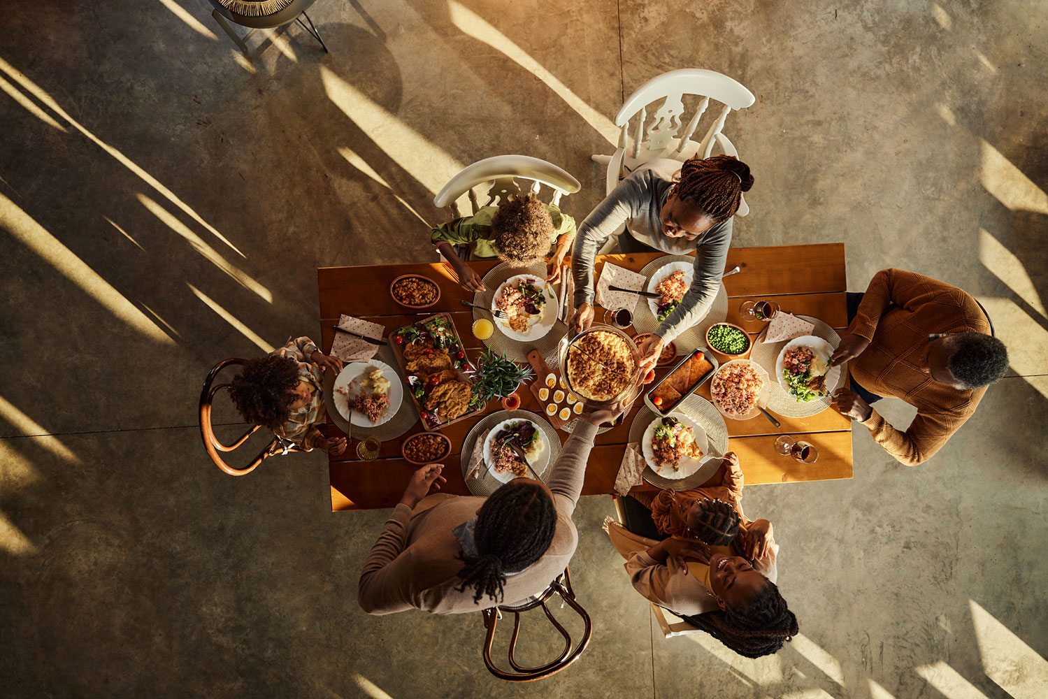 Above view of black extended family having lunch at dining table